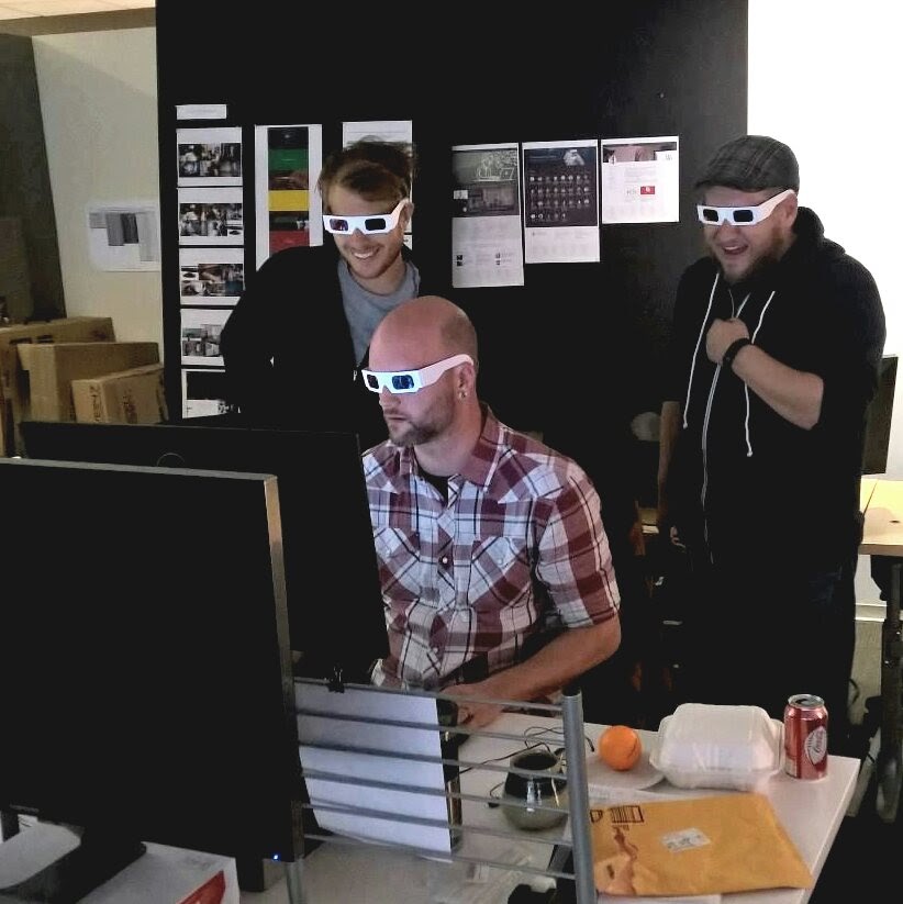 Three men wearing retro 3D glasses